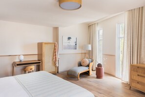 Sunlit spaces and organic textures set the scene for a stay that feels both luxurious and laid-back.