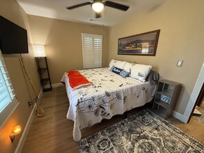 Master Bedroom with King Bed Vanity and Chair.