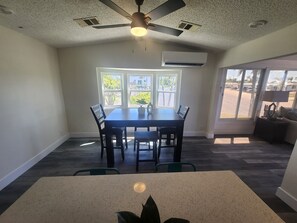 Bright space for memorable meals with views of palm trees swaying gently outside