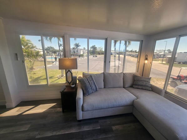 Bright, airy space with expansive windows and inviting seating perfect for relaxation!