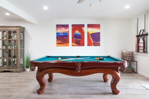Downstairs living - pool table, games and beach towels provided.