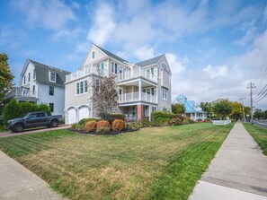Beautiful coastal home with a charming front yard, just a short distance from the beach.