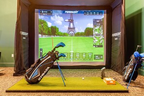 Our indoor golf simulator lets you play Pebble Beach in your pajamas. Oui, please.