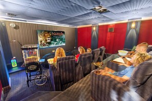 This private theater seats the whole crew for a blockbuster night in. Pajamas and pause buttons? Game changers.