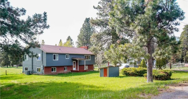 Front of lake house, lawn and well house
