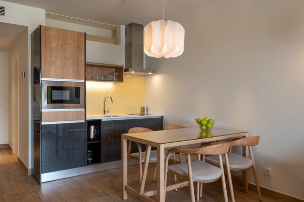 Unit with fully equipped kitchen