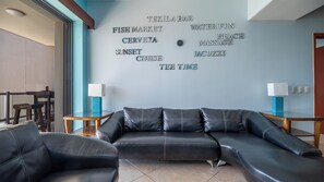 L shaped sofa and matching chair in the living room, with words to live by!