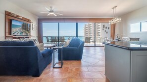 The spacious main living space combine the living room seating area, dining table and kitchen.