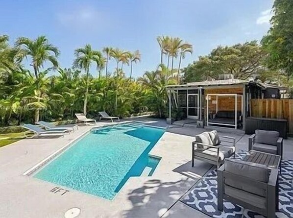 Spacious fenced backyard with a patio—perfect for outdoor entertaining, with pool and relaxation.