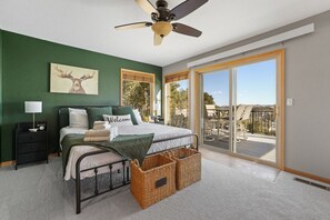 Unwind in the spacious master bedroom, designed for ultimate comfort and relaxation