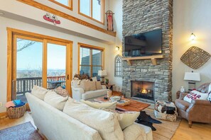 Welcome to Our Living Area! – A spacious, cozy retreat with plush seating, expansive windows, and an open floor plan, perfect for relaxation and gathering.