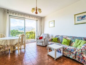Furniture, Flooring, Home, Floor, Chair, Shade, Apartment, Outdoor Furniture, Houseplant, Kitchen & Dining Room Table