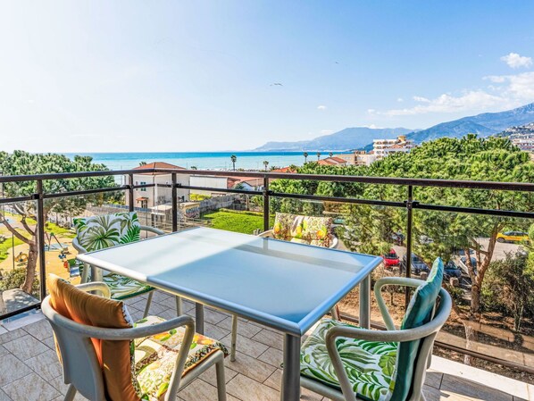 Furniture, Flooring, Home, Floor, Chair, Shade, Apartment, Outdoor Furniture, Houseplant, Kitchen & Dining Room Table