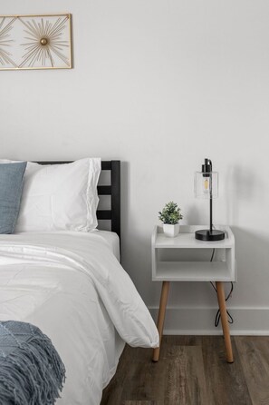 Relax in your queen bed and enjoy warm lighting on the stylish nightstand.