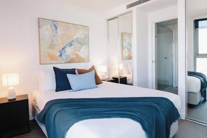 Light and airy Main Bedroom with access to the bathroom and mirrored wardrobes