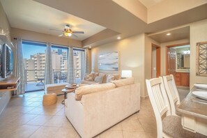 The main living space combines dining tablel with the living room, and terrace access as well.