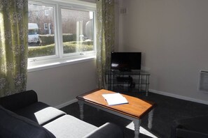 sofa and TV in sun 