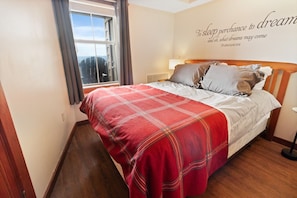 Queen bed in bedroom