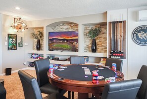 A Game Room with a poker table, board games, and more!