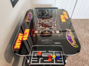 Challenge a friend to a retro round of Pac-Man or Galaga!