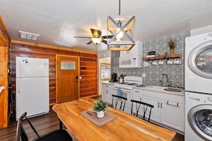 Kitchen, dining area, and washer and dryer in the cabin. Please bring any necessities that you do not see listed in the "Other Things to Note" section. They may or not be provided.