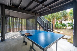 Ping pong table located in the back of the garage
