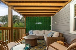 Unwind on plush outdoor couches in our serene cabin setting