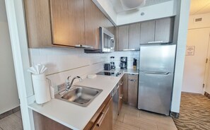 Full Kitchen with Coffee maker, Microwave & Stainless steel appliances.