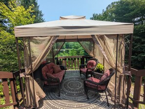 Covered deck off of cottage perfect for relaxing