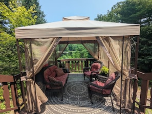 Covered deck off of cottage perfect for relaxing