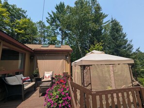 Deck off of cottage perfect for lounging 