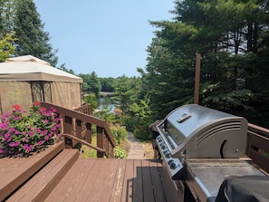 Deck off of cottage with views of the lake