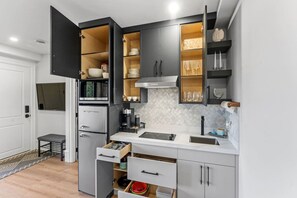 Modern appliances, including a cooktop, coffee station, and sleek fridge. 🍳☕ Perfect for cooking, dining, and entertaining in style. #ModernKitchen #KitchenEssentials #HomeCooking #GourmetMeals #LuxuryLiving