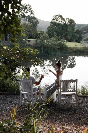 Your own private outdoor oasis—featuring a cozy seating area, a wood-fired pizza oven, and a BBQ.