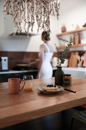 A beautifully crafted, locally made kitchen, fully equipped with everything you need to cook and enjoy delicious meals during your stay.