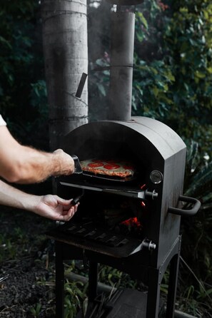 Fire up the wood-fired pizza oven and enjoy a delicious meal with stunning dam views. The perfect spot for a cozy, alfresco dining experience under the open sky.