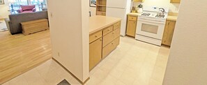 Ahead, the Living area, To the right the Kitchen