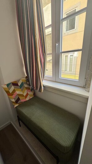 Cozy window seat with cushion & pillow – your Lisbon sunshine spot!