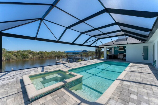 Sparkling pool & spa overlooking the water. Pool size: 30' L x 11' W x 5.5' D
