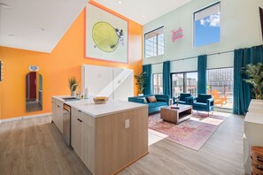 Tequila Sunrise unit: Open concept living room / kitchen / murphy beds