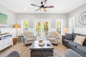 Living room features seating for all and a smart tv. Perfect place to unwind together in the evenings!