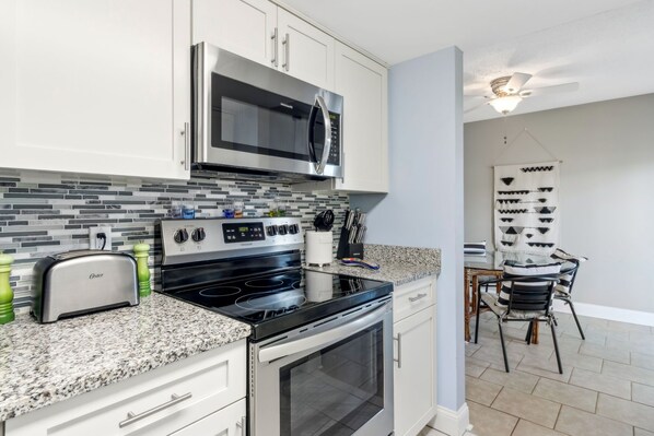 Bright White Cabinets in the Fully Equipped Kitchen
