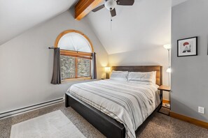 Bedroom 1: King bed, main floor, en-suite bathroom, walk-in closet, dedicated workspace