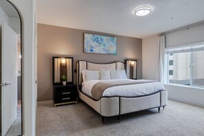 King Bedroom luxuriously designed. 75"TV. Extremely comfortable with an attached bathroom and walk in closet.