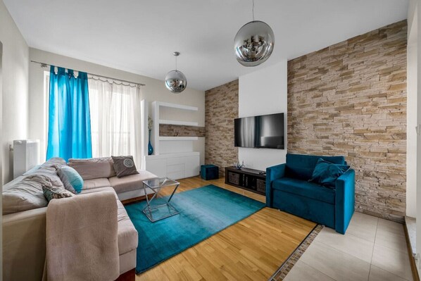 Living Room with 2 Sofa Beds and Big Smart TV | Book Now with RENTUJEMY.COM