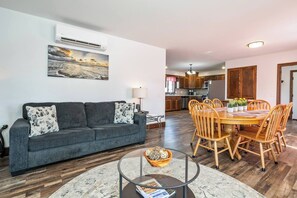 This thoughtfully designed area blends comfort and charm, featuring plush seating, rustic wood accents, and modern decor 
