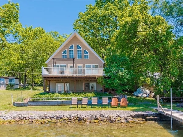 Wake up to this postcard-perfect view of the lake. Enjoy direct water access and a peaceful setting for the ultimate retreat. "Lake House"