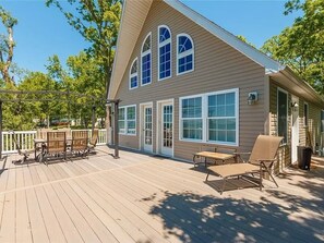 The ultimate relaxation spot! This over sized deck offers ample space for lounging, dining, and enjoying the fresh lake breeze. "Lake House"
