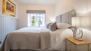 Relax in this peaceful bedroom after a day exploring