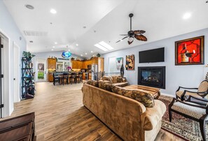 Inviting main living room featuring a smart TV & access to a balcony
